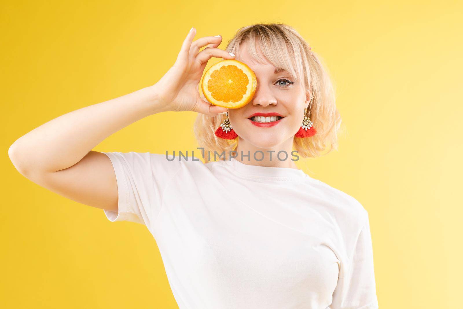 Portrait of a cool cheerful woman girl with oranges. Juice ads. Positive, harmony.