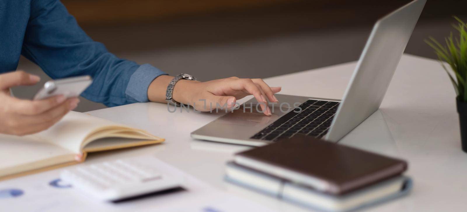 A businesswoman using an online banking program in order to open a digital savings account. The definition of cyber security. by wichayada