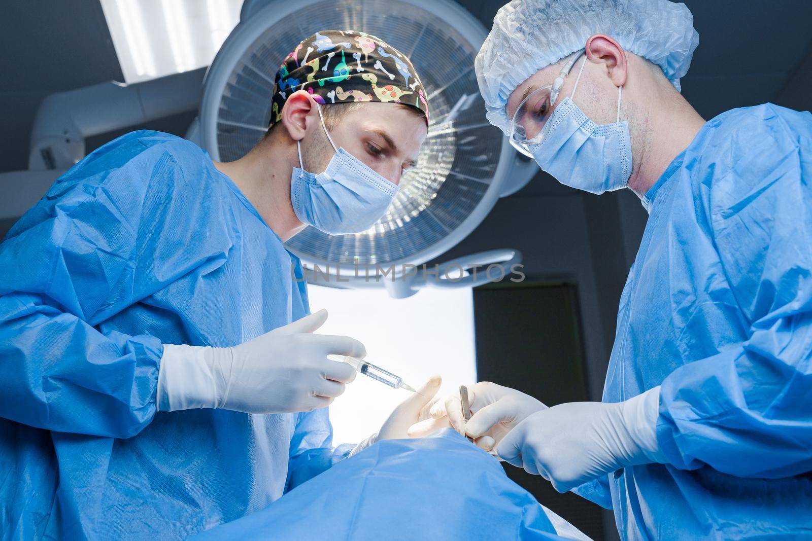 Anesthesia thigh injection before Buccal fat removal. Bisha lumps removal. Surgery operation for modifying the eye region of the face in medical clinic