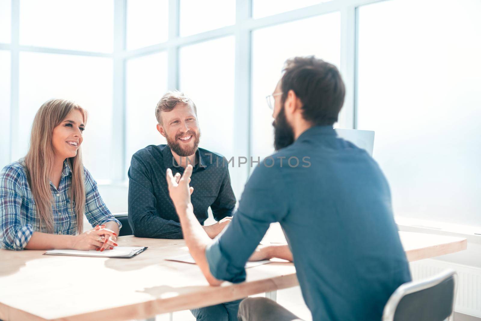 group of business people sitting at the office table. the concept of employment