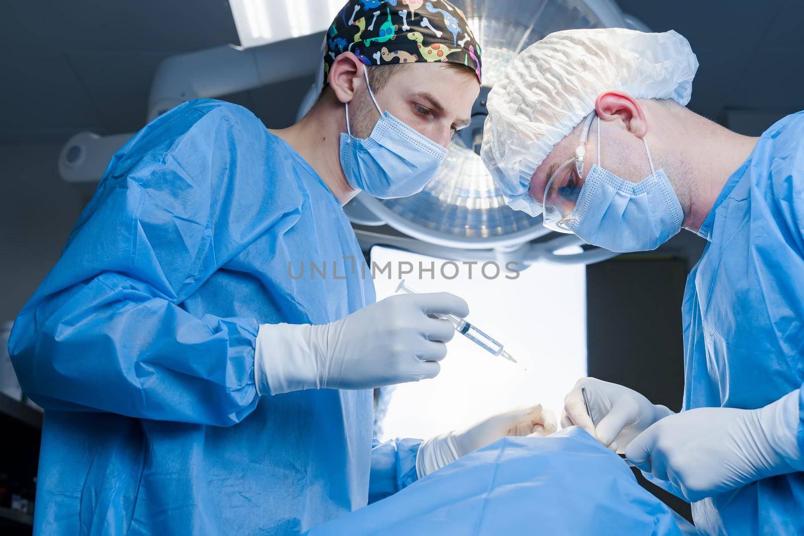 Anesthesia thigh injection before Buccal fat removal. Bisha lumps removal. Surgery operation for modifying the eye region of the face in medical clinic