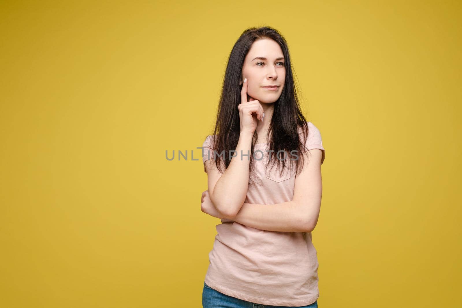 Portrait of happy fashion female with nice hairstyle and beautiful blue eyes posing at studio. Cheerful girl looking away and smiling. Isolated