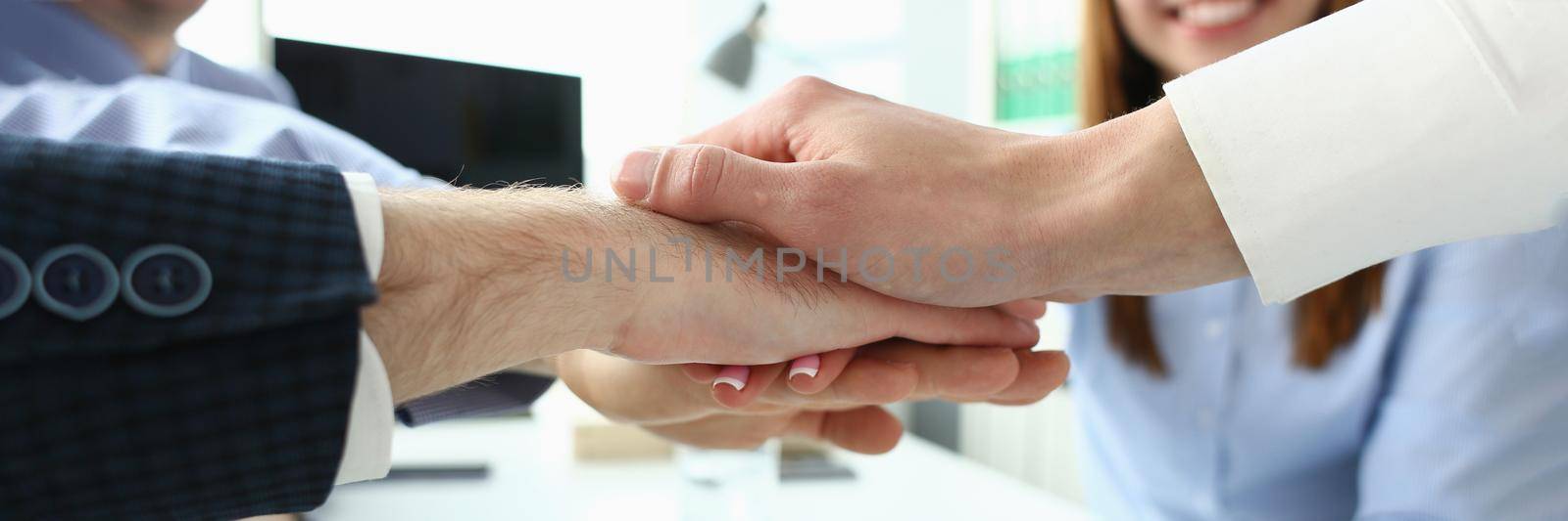 Focus on folded hands on each other. Businessmen discussing stipulation of profitable contract and closing bargain. Business meeting concept. Blurred background