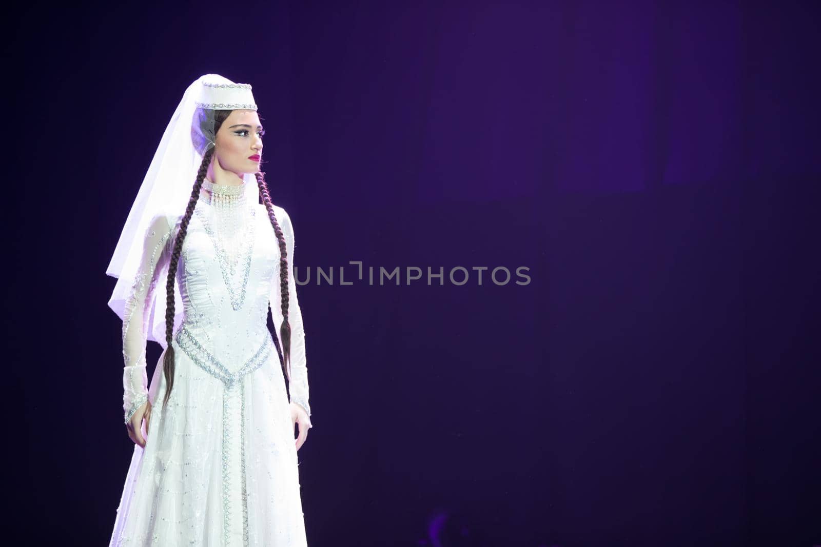 Belarus, Gomel, February 27, 2018. Concert hall. Speech of the national Georgian ballet Sukhishvili.A Georgian woman in a national white costume dances Georgian dance