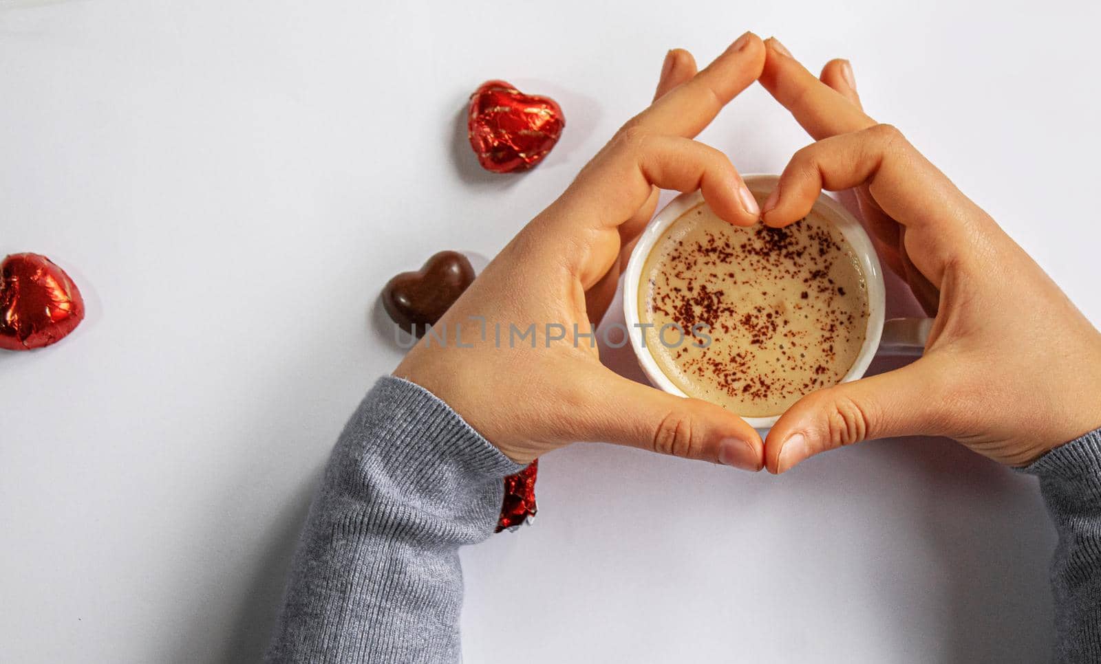 Cup drink for Breakfast in the hands of lovers. Selective focus. by mila1784