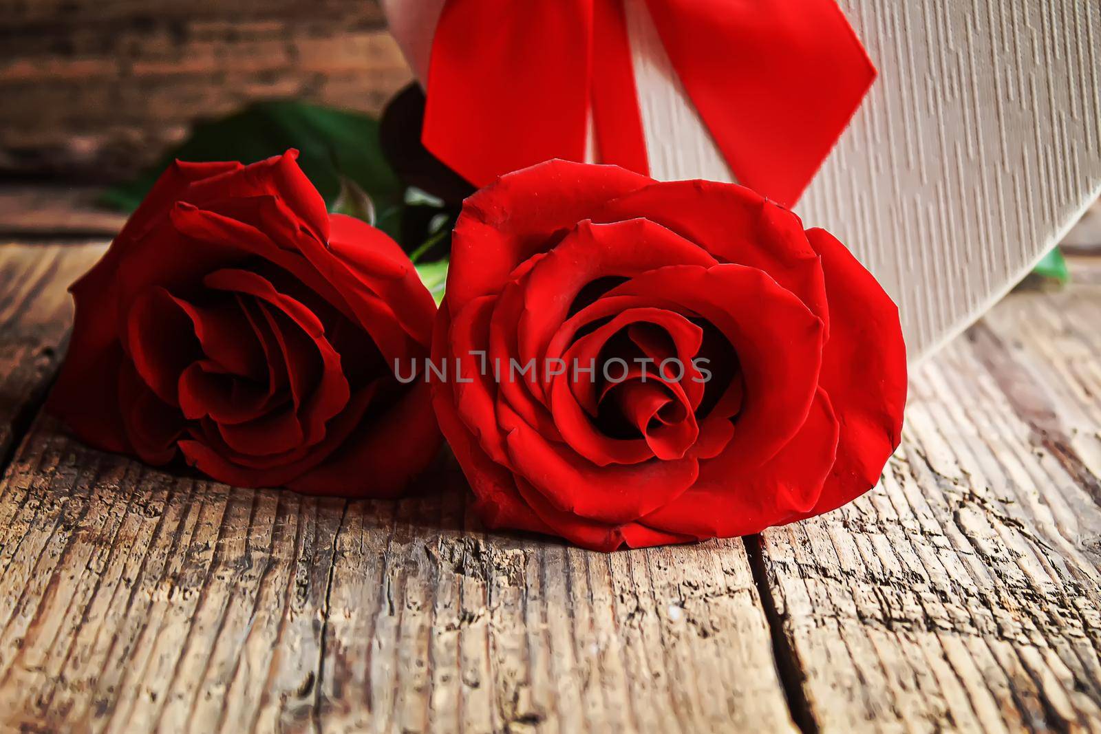 Gift box on a wooden background. Valentine's Day gift.selectiv focus by mila1784