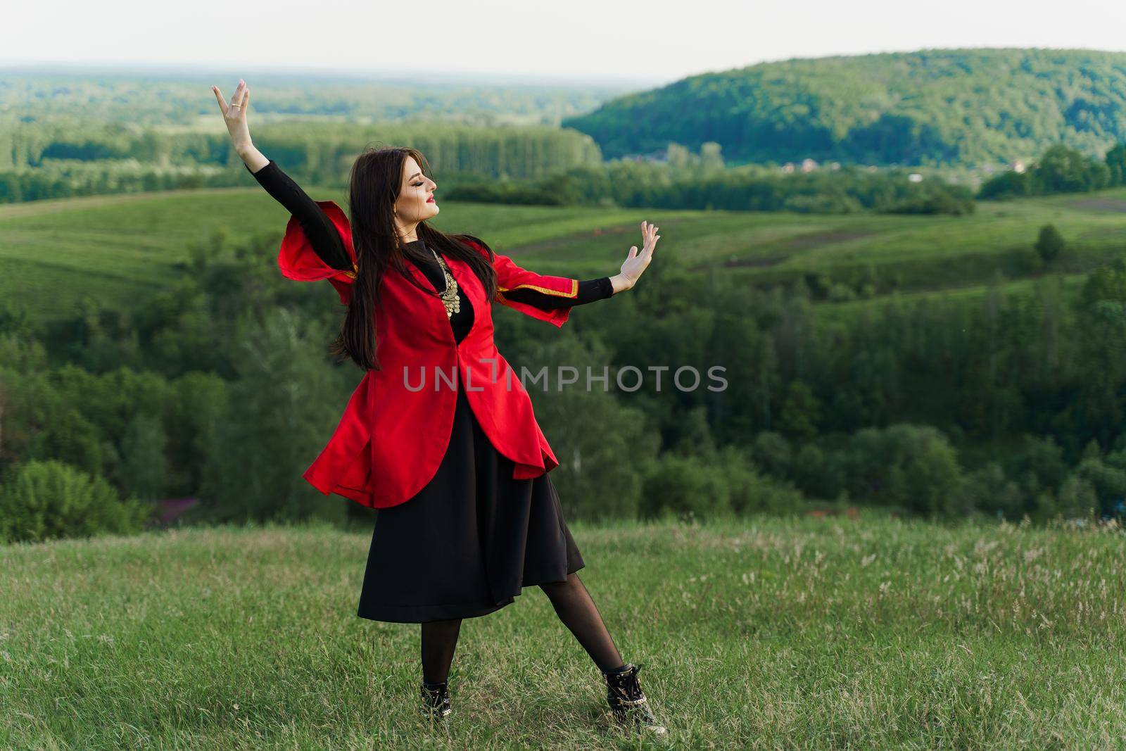 Georgian girl dances national dance named: rachuli, acharuli, osuri, shalaxo, mtiuluri. on the green hills of Georgia. Georgian culture lifestyle. by Rabizo