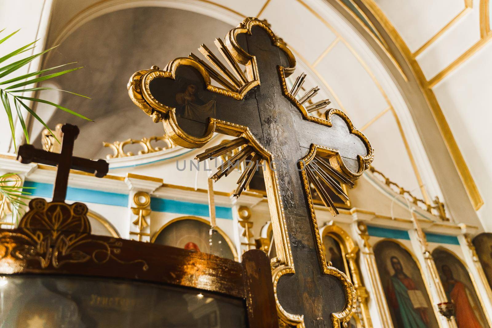 Huge Orthodox cross in the church interior. Orthodox tradition and faith. Equipment for praying. Pray for people life. Pray to god
