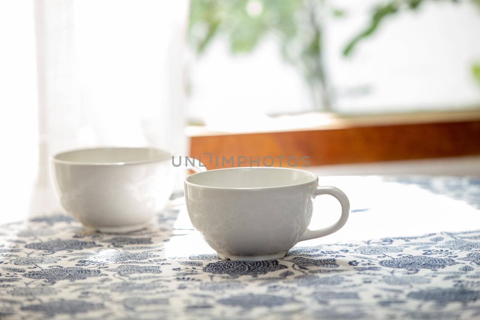 Coffee in the morning, Two white cup of espresso on the table in home. by qualitystocks