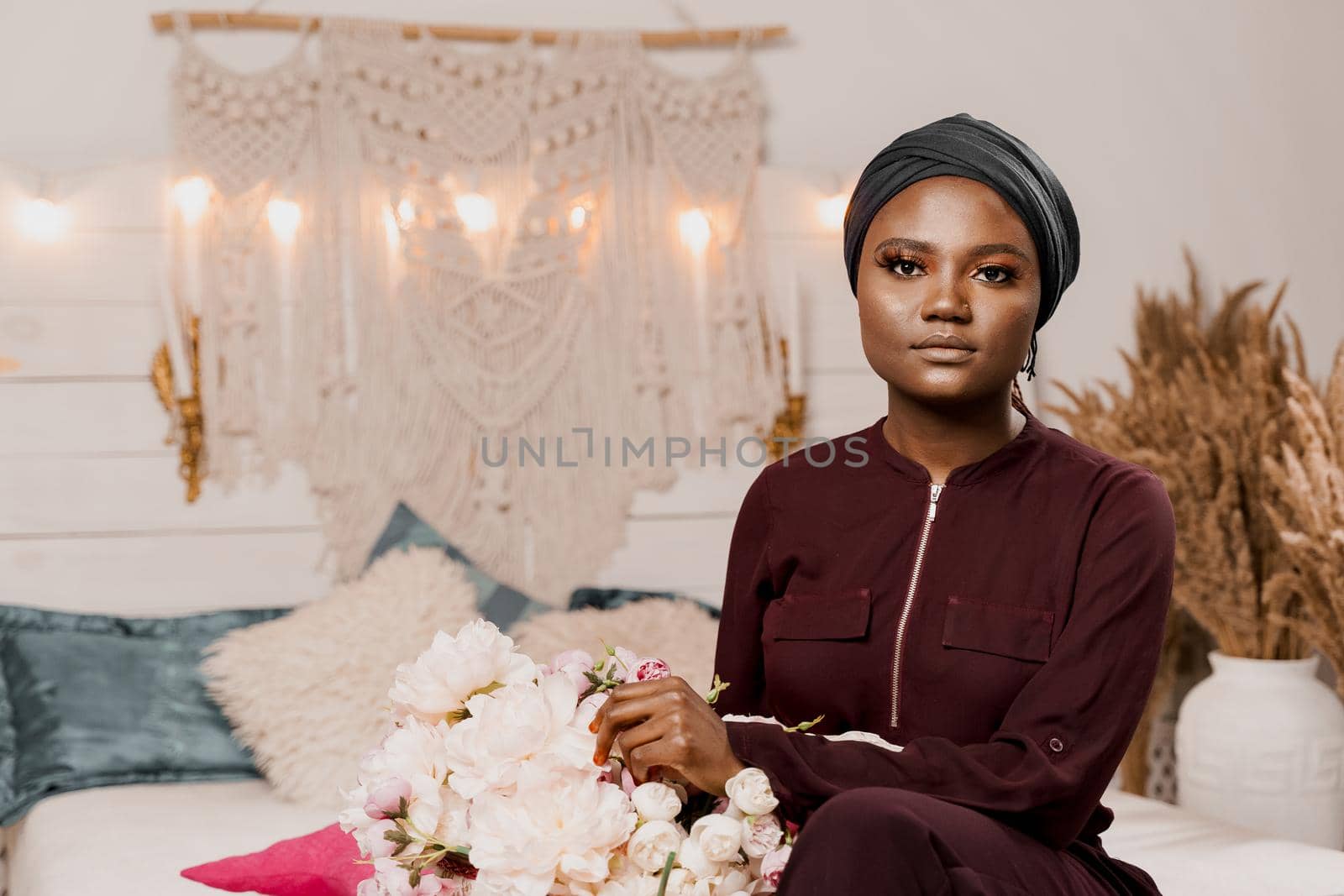 Muslim girl with bouquet of flowers from her boyfriend on the valentines day. Holiday celebration. by Rabizo