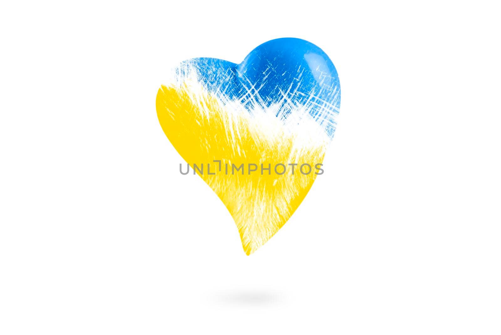 No war in Ukraine. Broken blue-yellow heart on a white isolated background. Save Ukraine. The heart is painted in the colors of the Ukrainian flag - blue and yellow