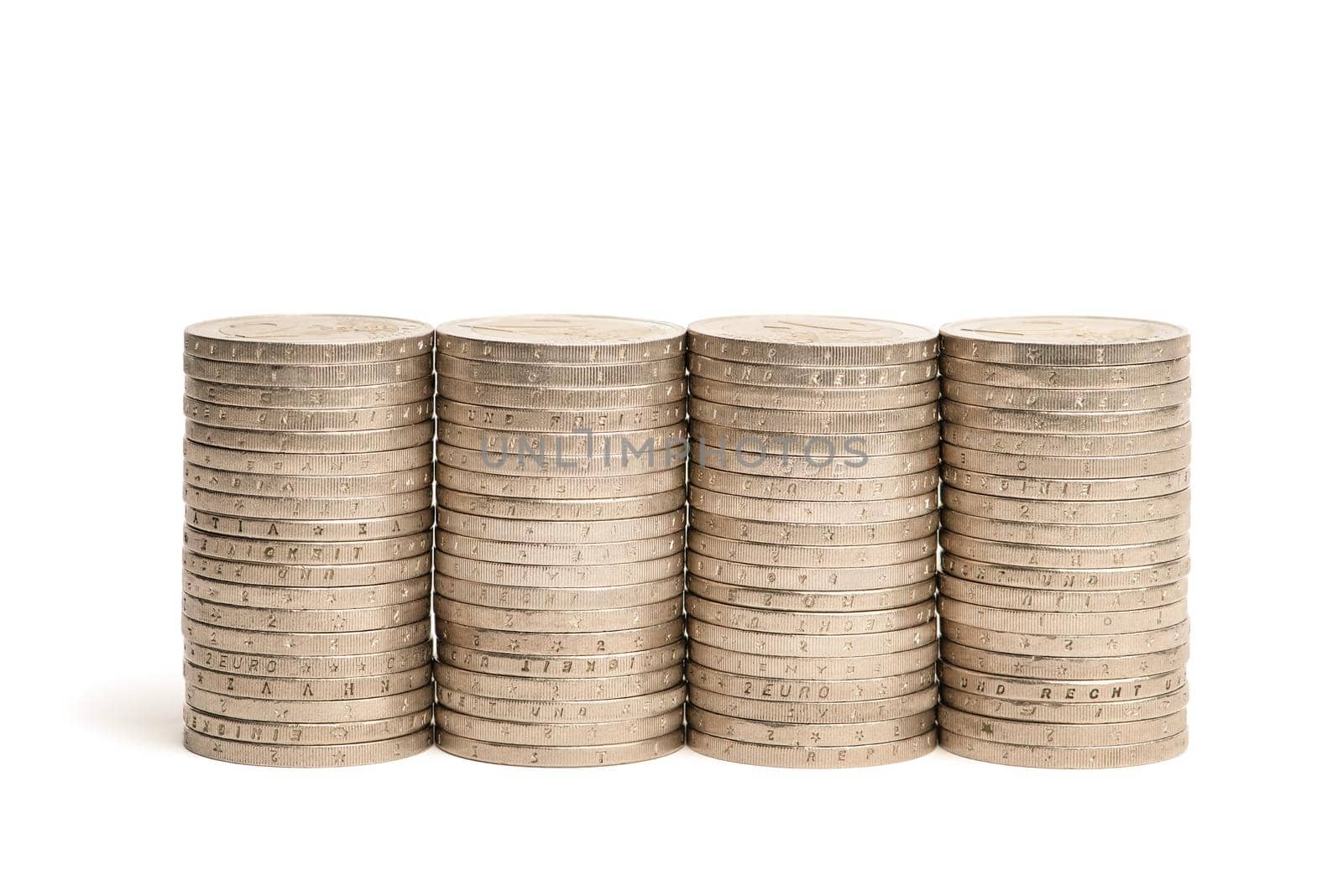 Stacks of coins on a white isolated background. 2 euro coins in a stack. by SERSOL