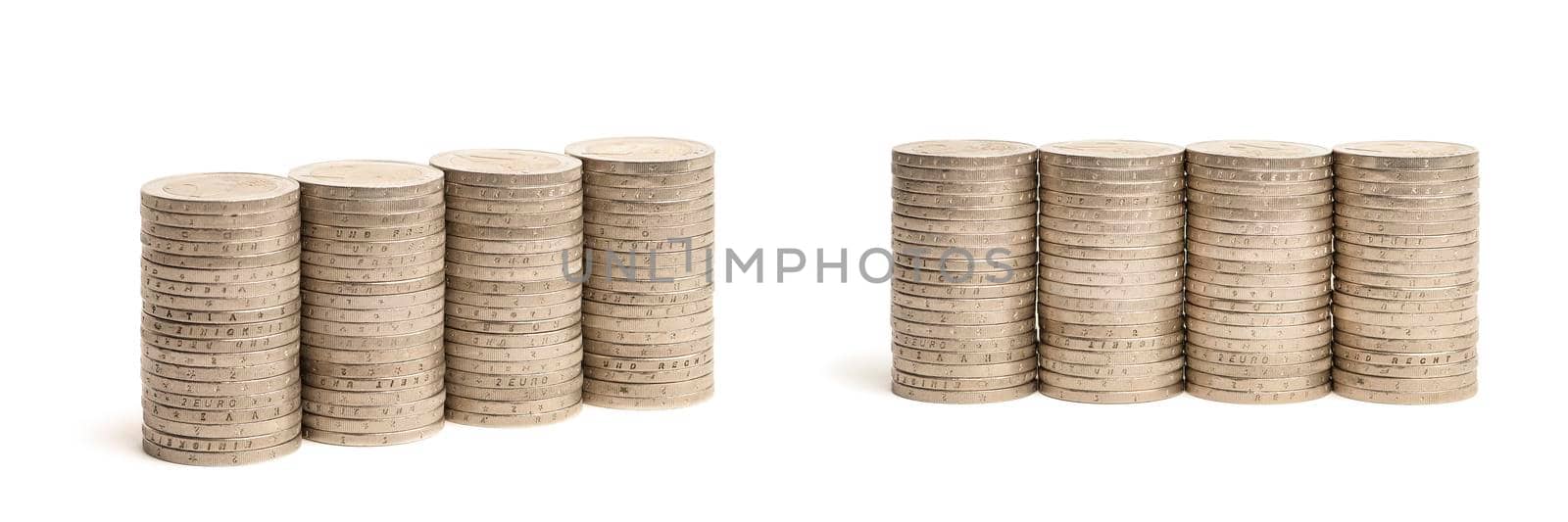 Stacks of coins on a white isolated background. 2 euro coins in a stack