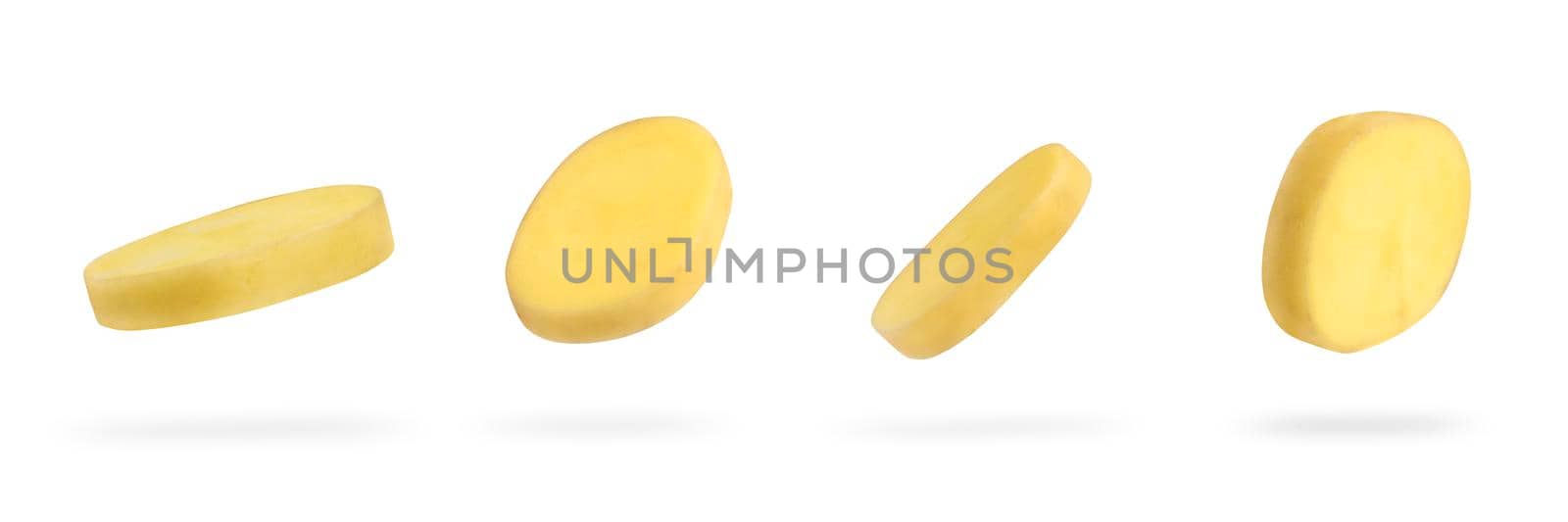 A slice of fresh unpeeled potatoes falls on a white background. A set of chopped raw potatoes. Food levitation concept. High resolution image.