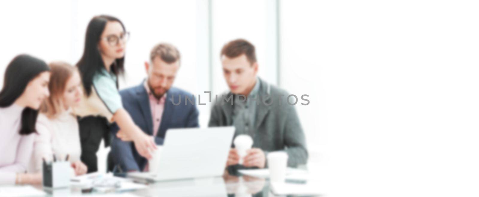 blurred image for the advertising text. business team discusses the new business plan at a briefing in the office. the concept of teamwork