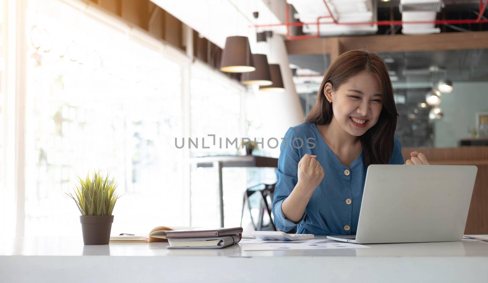 Happy excited successful businesswoman triumphing in office, Portrait of Business people employee freelance online marketing e-commerce telemarketing concept. by wichayada