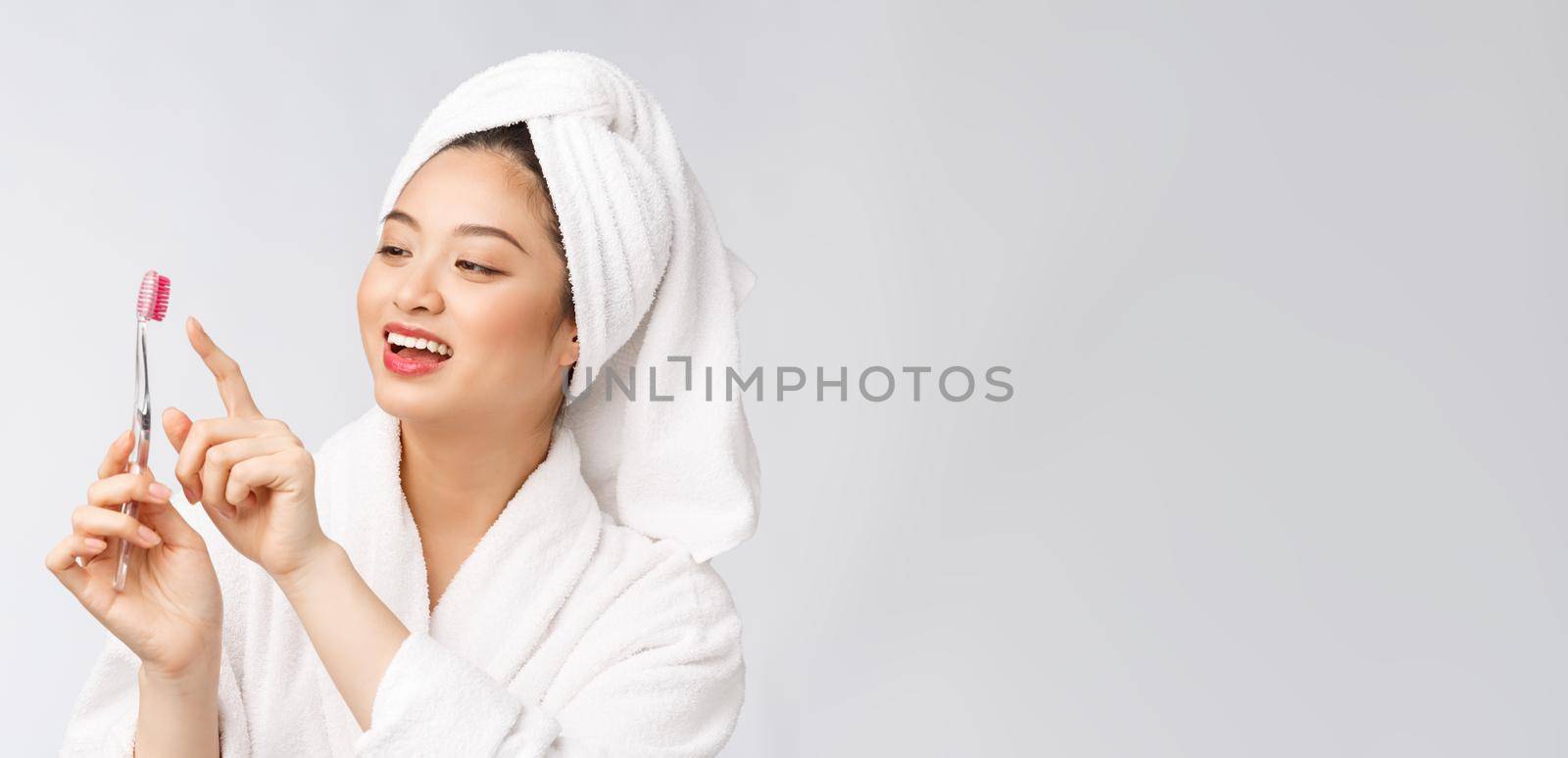 Close up of Smile woman brush teeth. great for health dental care concept, Isolated over white background. asian. by Benzoix