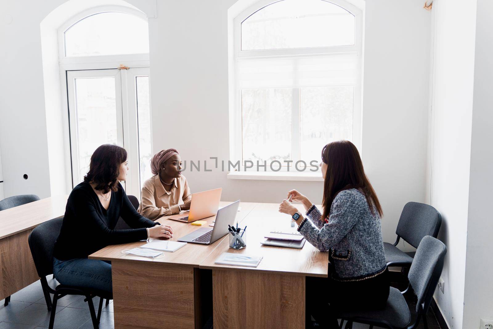 Foreign school private study with a school girl. Teacher explain grammar of native language using laptop. Prepearing to exam with tutor by Rabizo