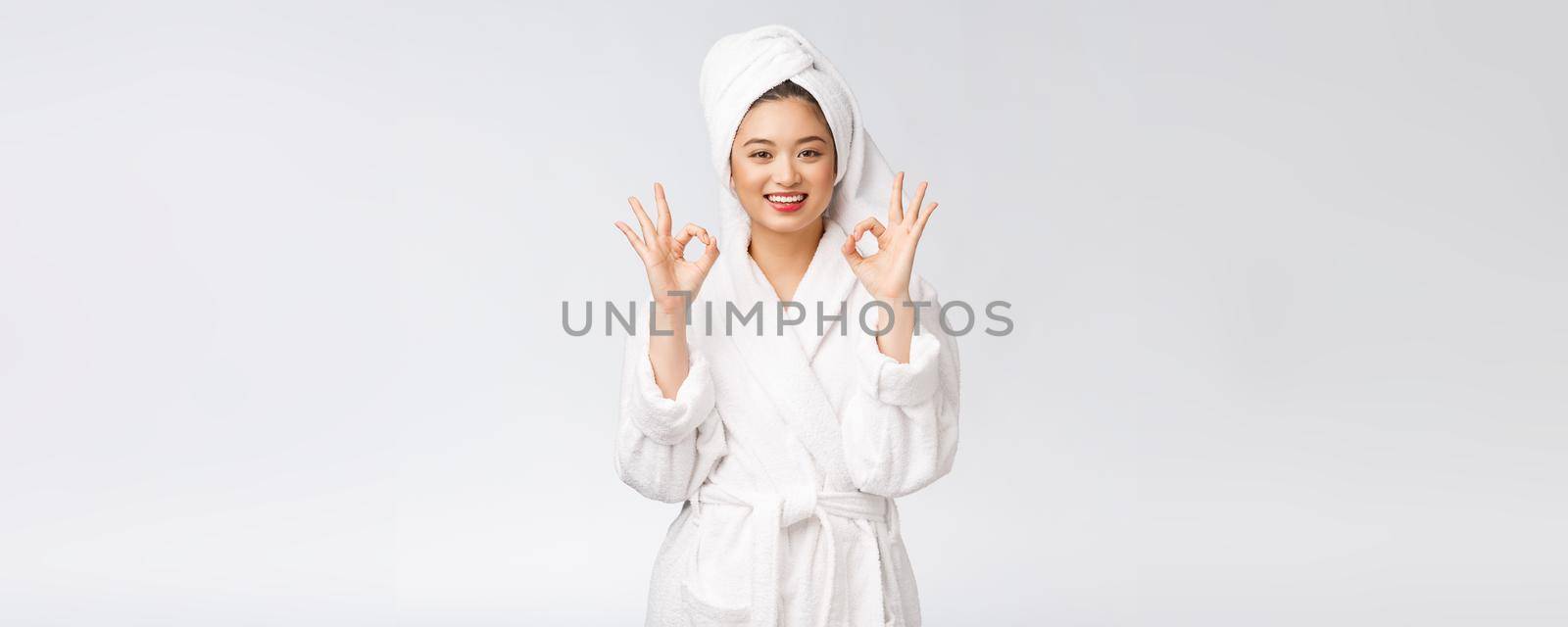 beauty asian woman ok gesture for good facial product. isolated on white background. beauty and fashion concept. by Benzoix