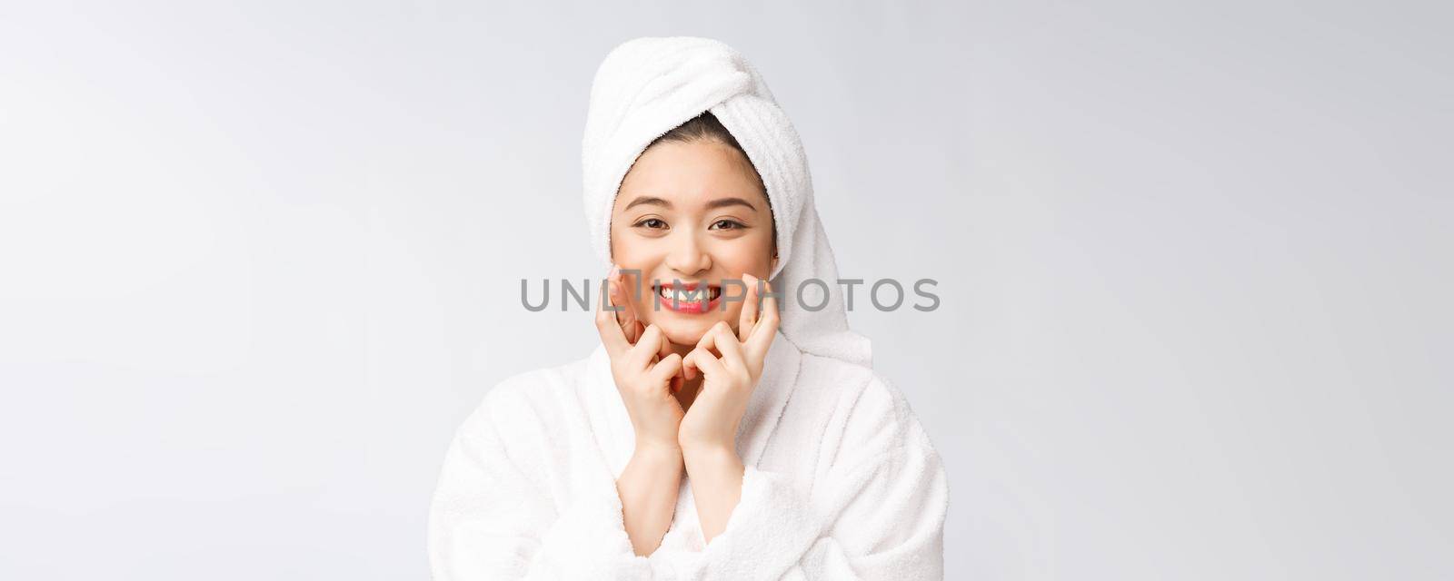 Spa skincare beauty Asian woman drying hair with towel on head after shower treatment. Beautiful multiracial young girl touching soft skin.