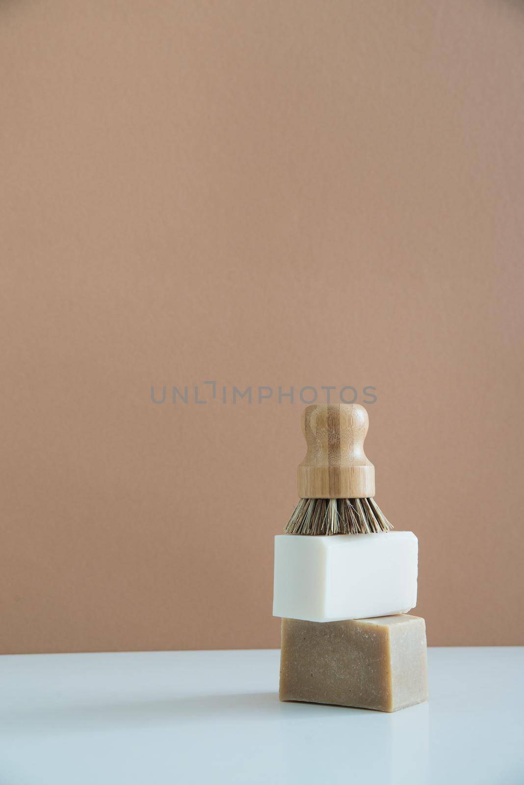 zero waste bamboo brush with soap for dishwashing in minimalistic style. High quality photo