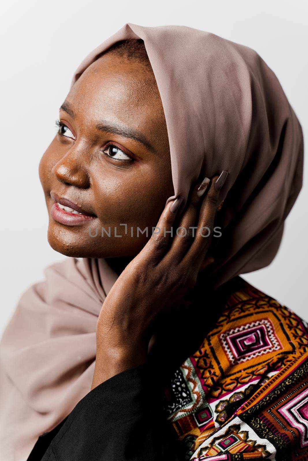 Dreamy black girl weared hijab smile and rejoise on white background. Muslim happy woman posing in studio. Attractive african female.