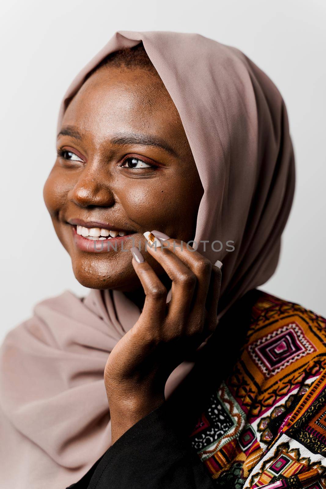 Dreamy black girl weared hijab smile and rejoise on white background. Muslim happy woman posing in studio. Attractive african female.