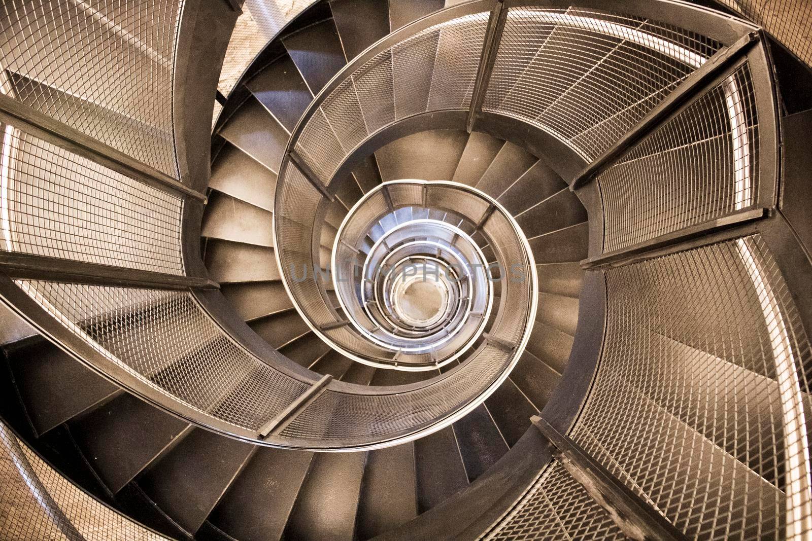 Modern spiral metallic staircase in tourist building City Tower in Innsbruck
