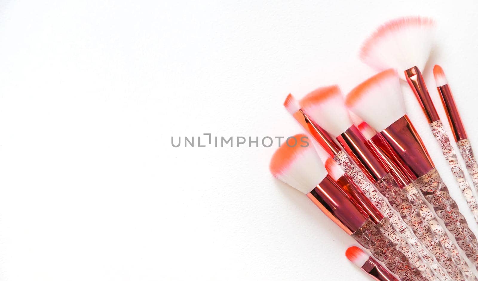 Makeup brushes on a white background. Selective focus.