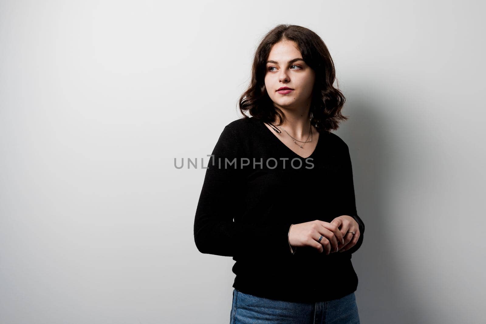 Young woman student on white background. Attractive girl teacher explain rules in english class. Education in university. Foreign school private study with a school girl.