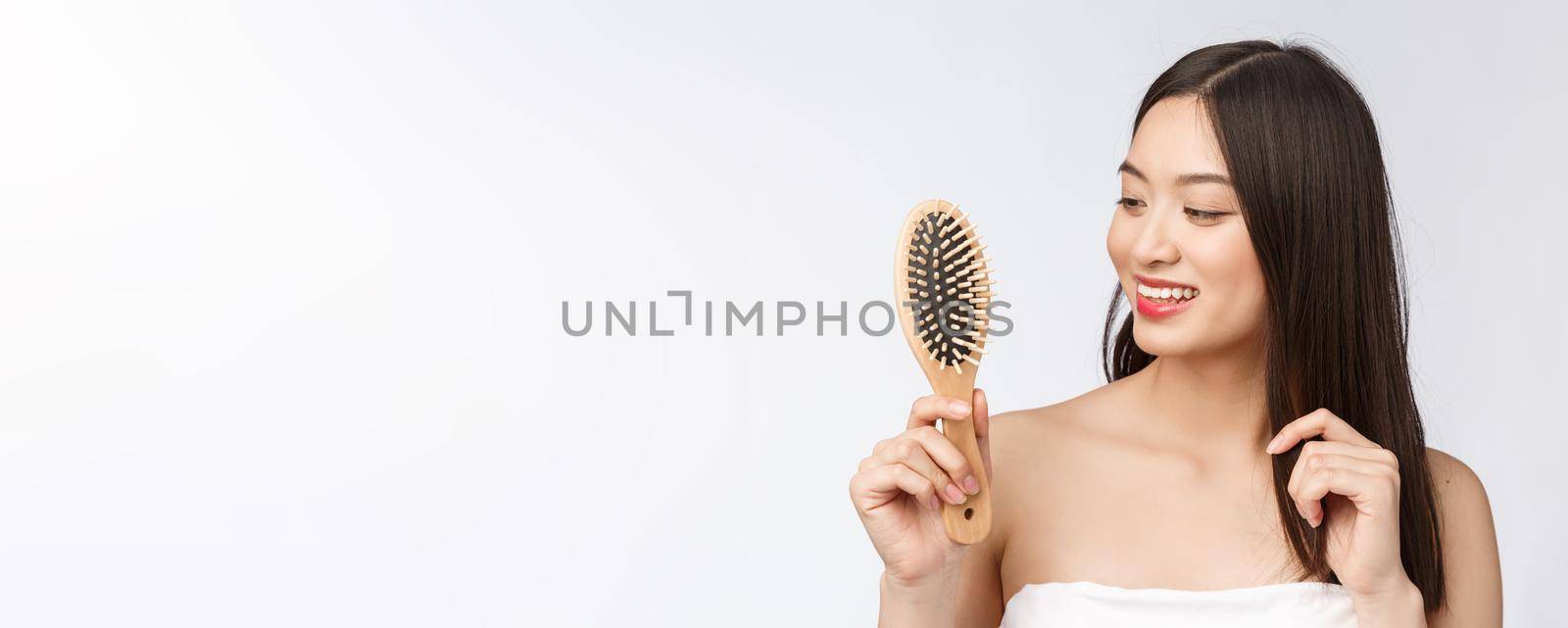 portrait of a beautiful young woman comb wonderful hair isolated on white background, asian beauty by Benzoix