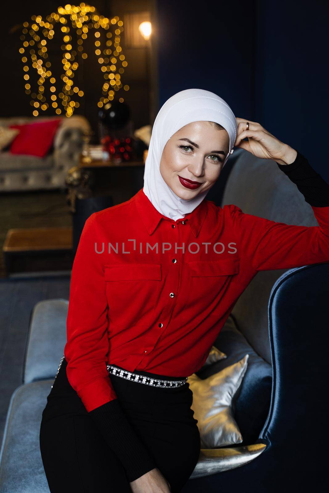 Muslim woman near christmas decoration in studio. Professional muslim model posing at the new year eve by Rabizo