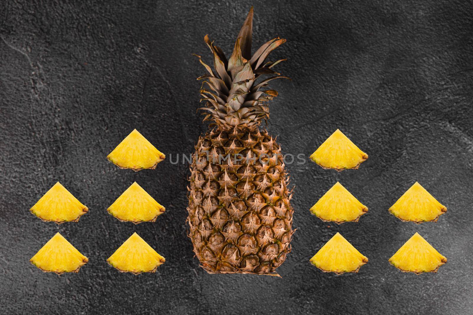 Pineapple tropical fruit on dark stone background background. Citrus fruit with vitamin c for helth care. by Rabizo