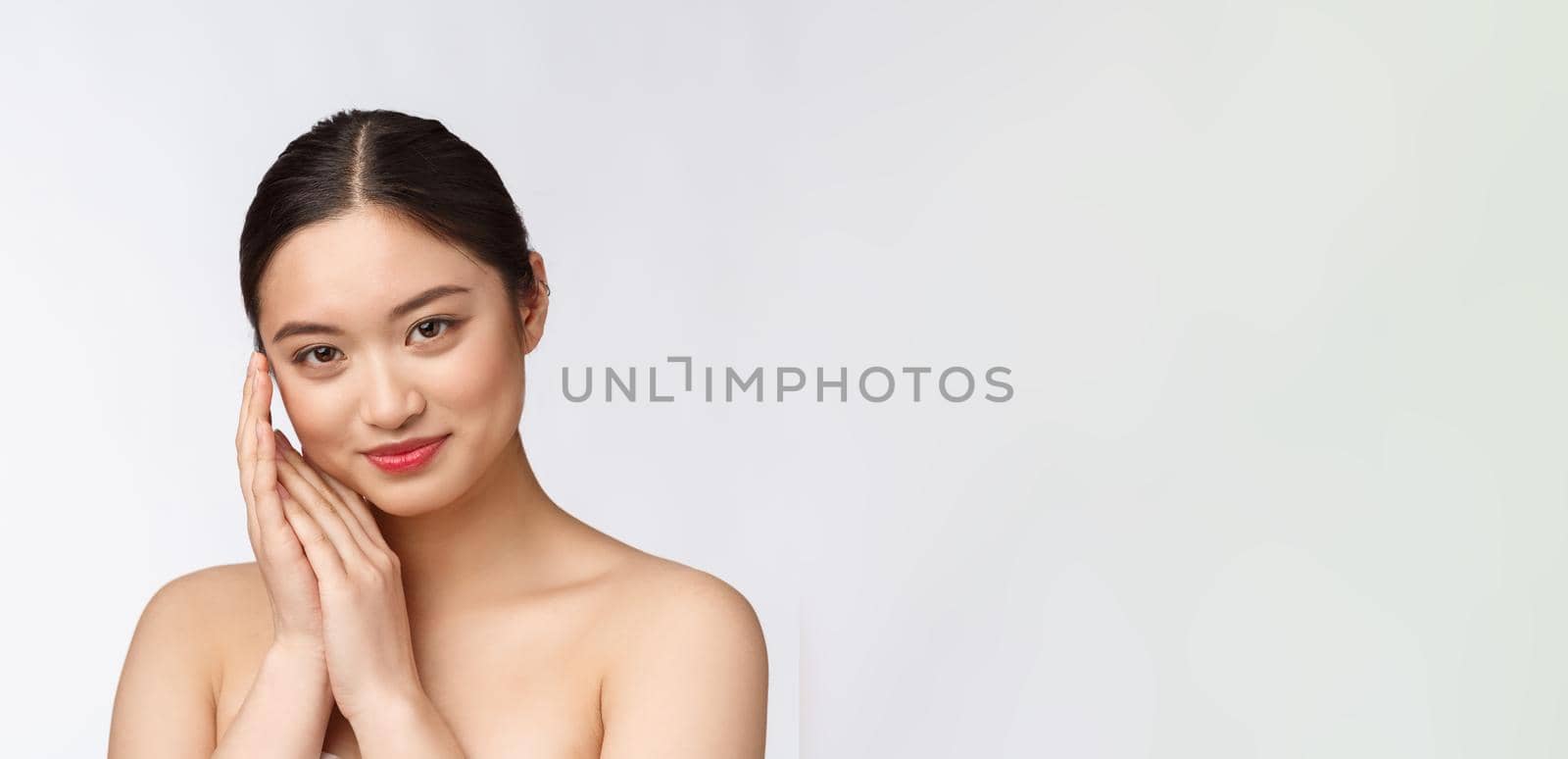 Beautiful asian woman makeup of cosmetic, girl hand touch cheek and smile, face of beauty perfect with wellness isolated on white background