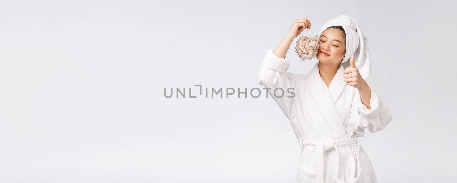 Asian woman being happy with the shower. Studio concept.