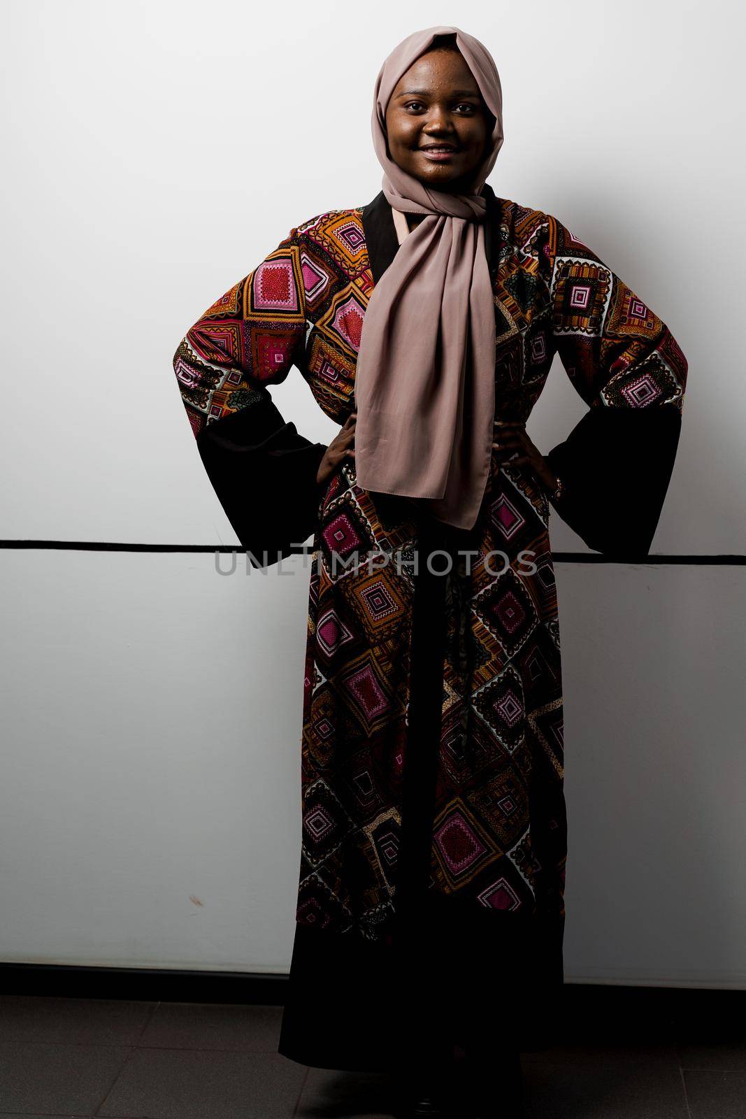 Black girl weared hijab smile and rejoise on white background. Muslim happy woman posing in studio. Attractive african female by Rabizo