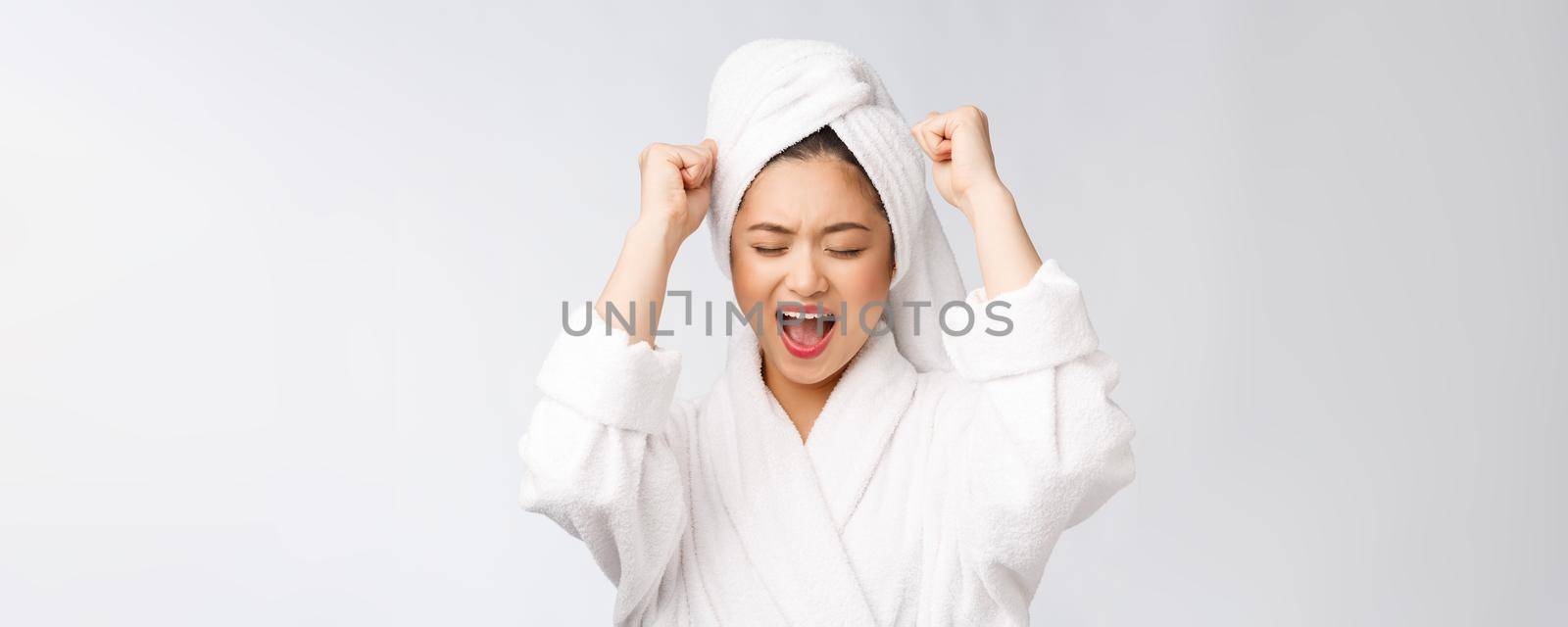 Spa skincare beauty Asian woman drying hair with towel on head after shower treatment. Beautiful multiracial young girl touching soft skin.