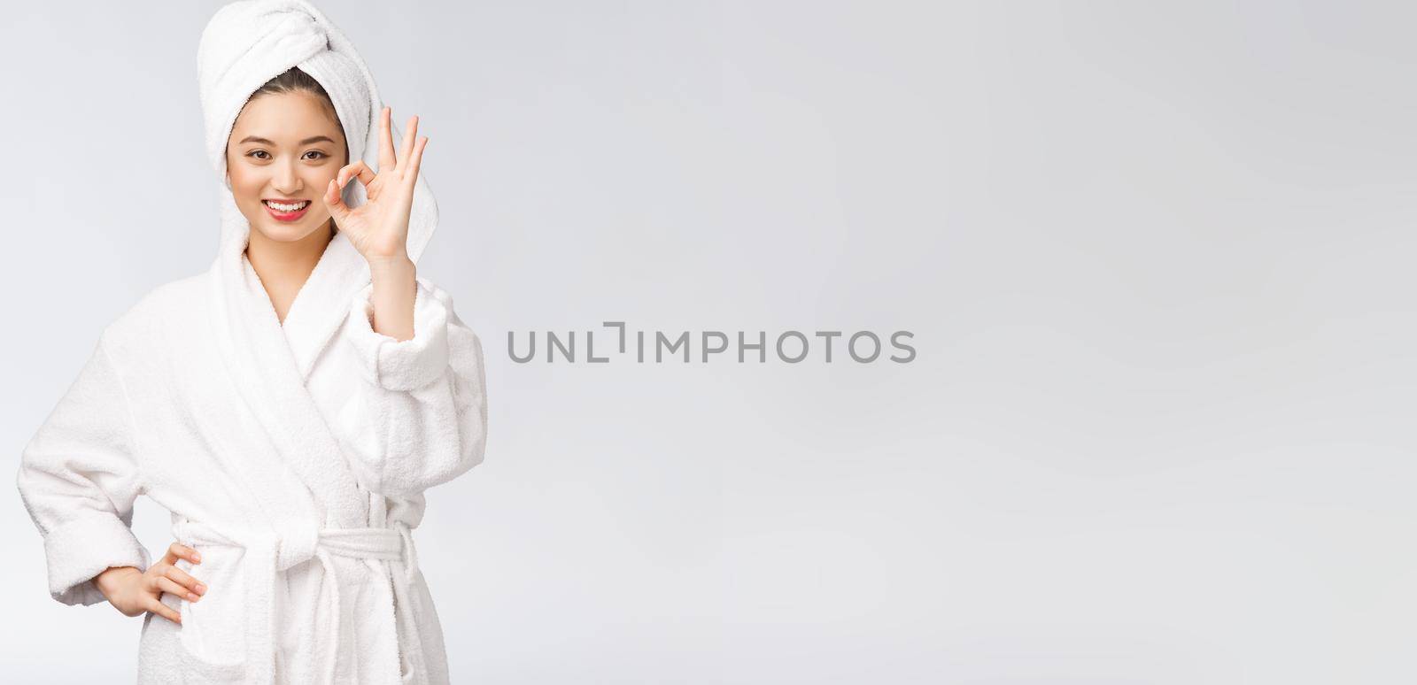 beauty asian woman ok gesture for good facial product. isolated on white background. beauty and fashion concept