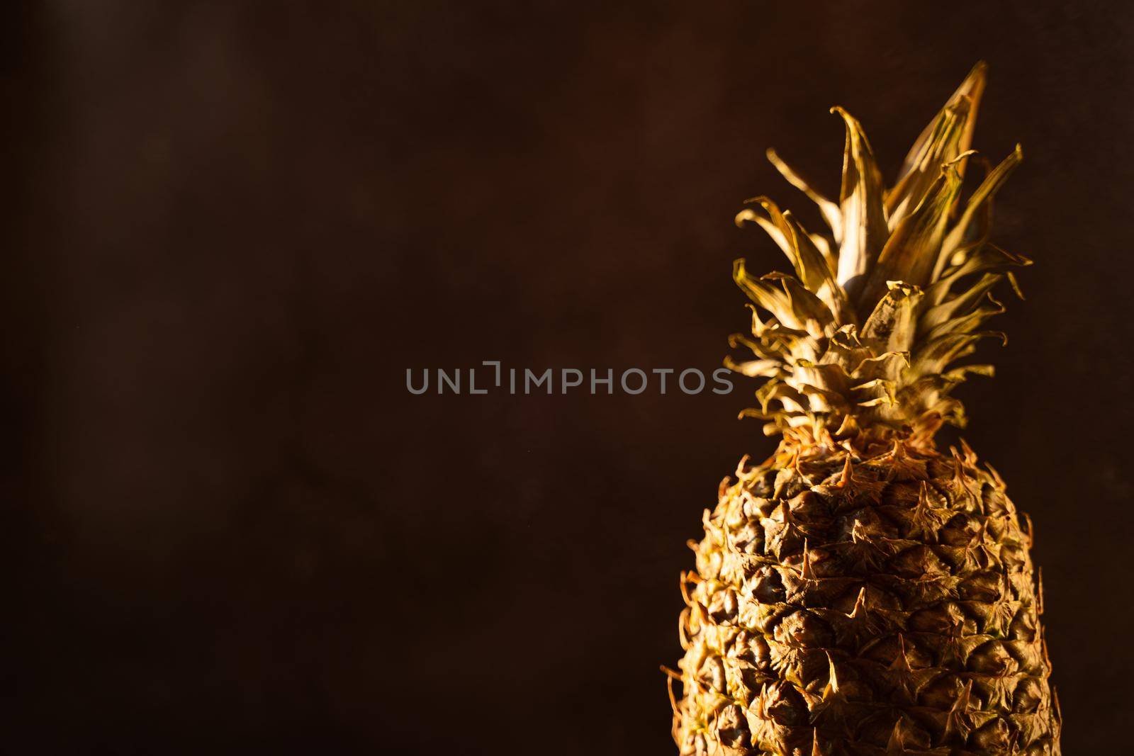 Pineapple tropical fruit on black background. Citrus fruit with vitamin c for helth care. by Rabizo