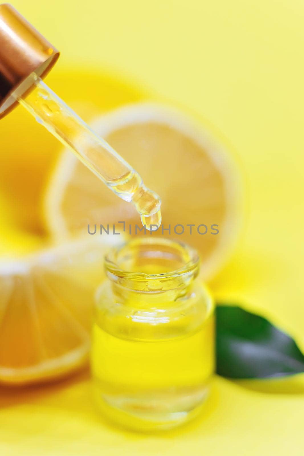 lemon essential oil on a yellow background. Selective focus.nature