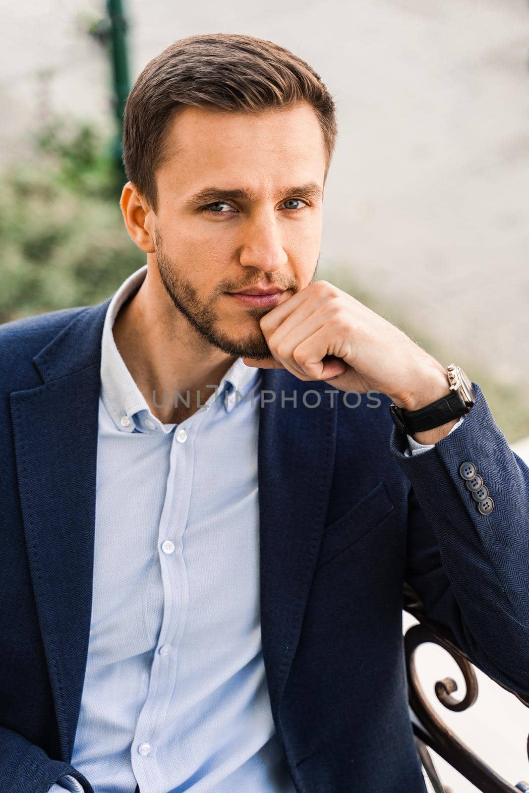 Handsome man with cup of coffee in cafe. Morning lifestyle of male