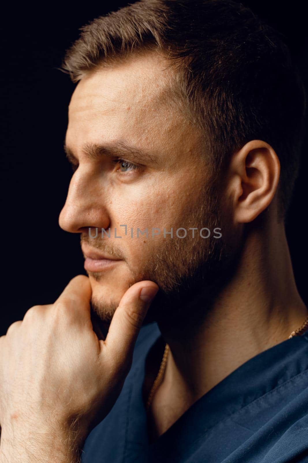 Handsome man with fashion hair style and beard. Advert for barbershop and hair stylish. Confident business man on dark background