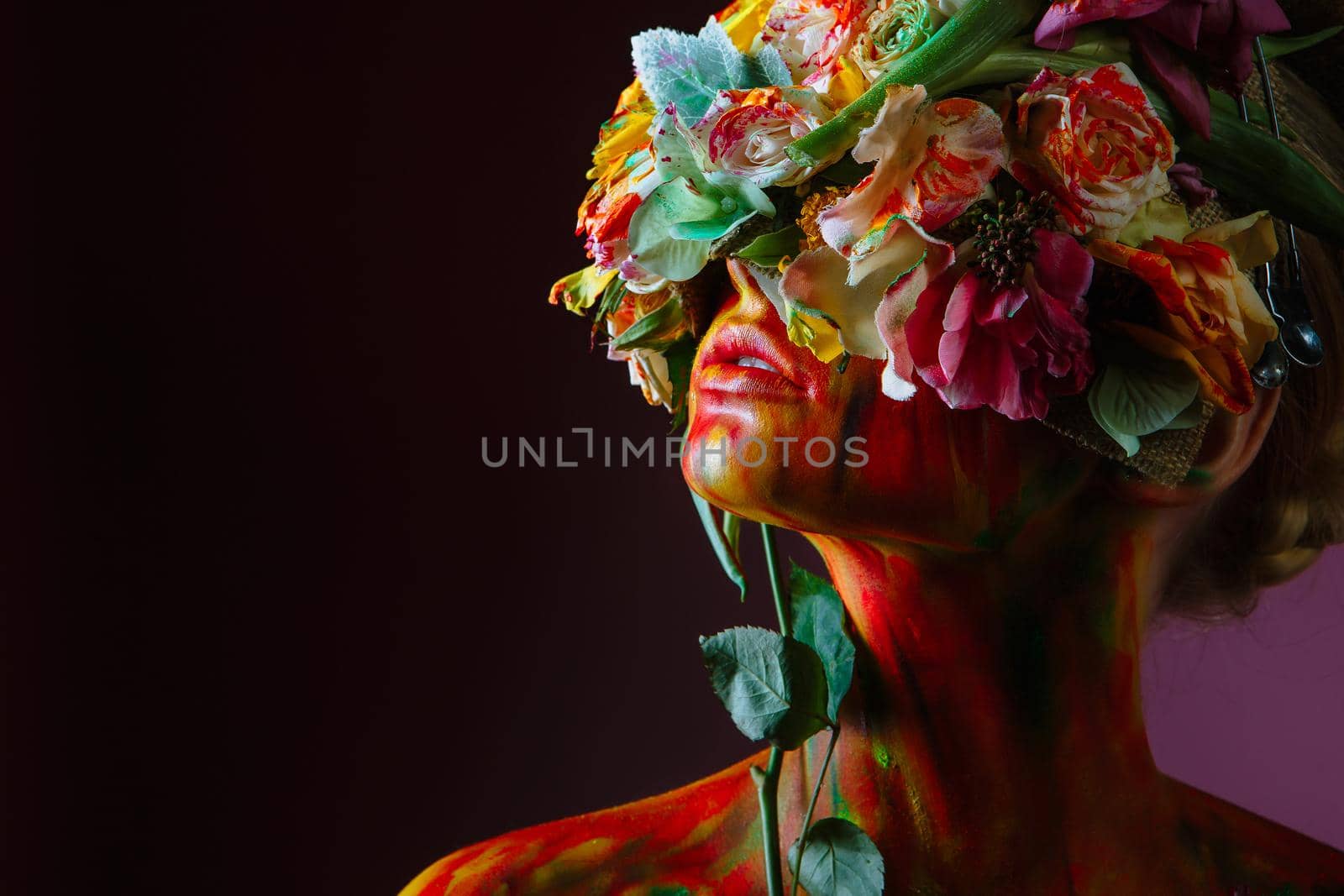 A girl with fresh flowers on her head. Flower Man