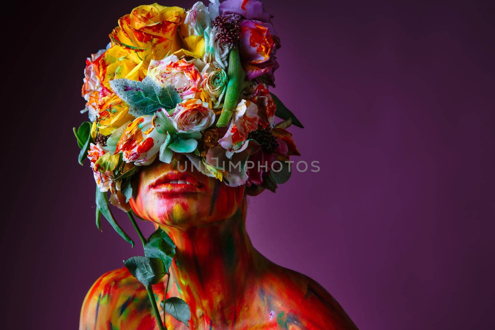 A girl with fresh flowers on her head. Flower Man