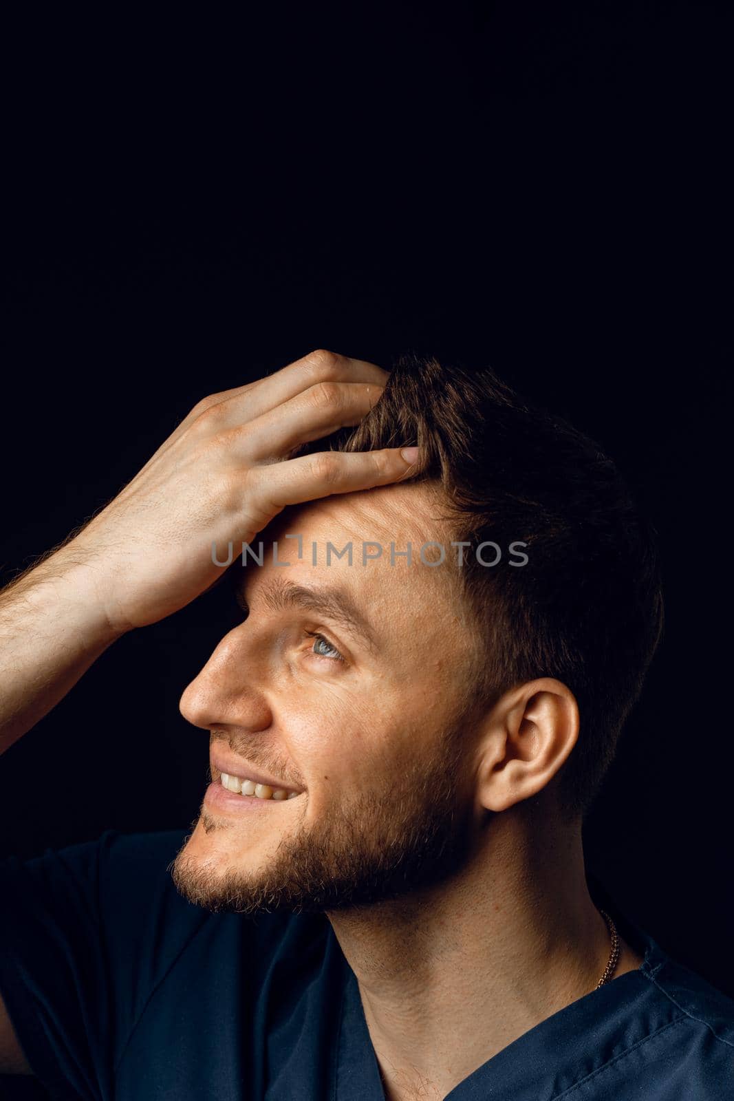 Handsome man with fashion hair style and beard. Advert for barbershop and hair stylish. Confident business man on dark background. by Rabizo