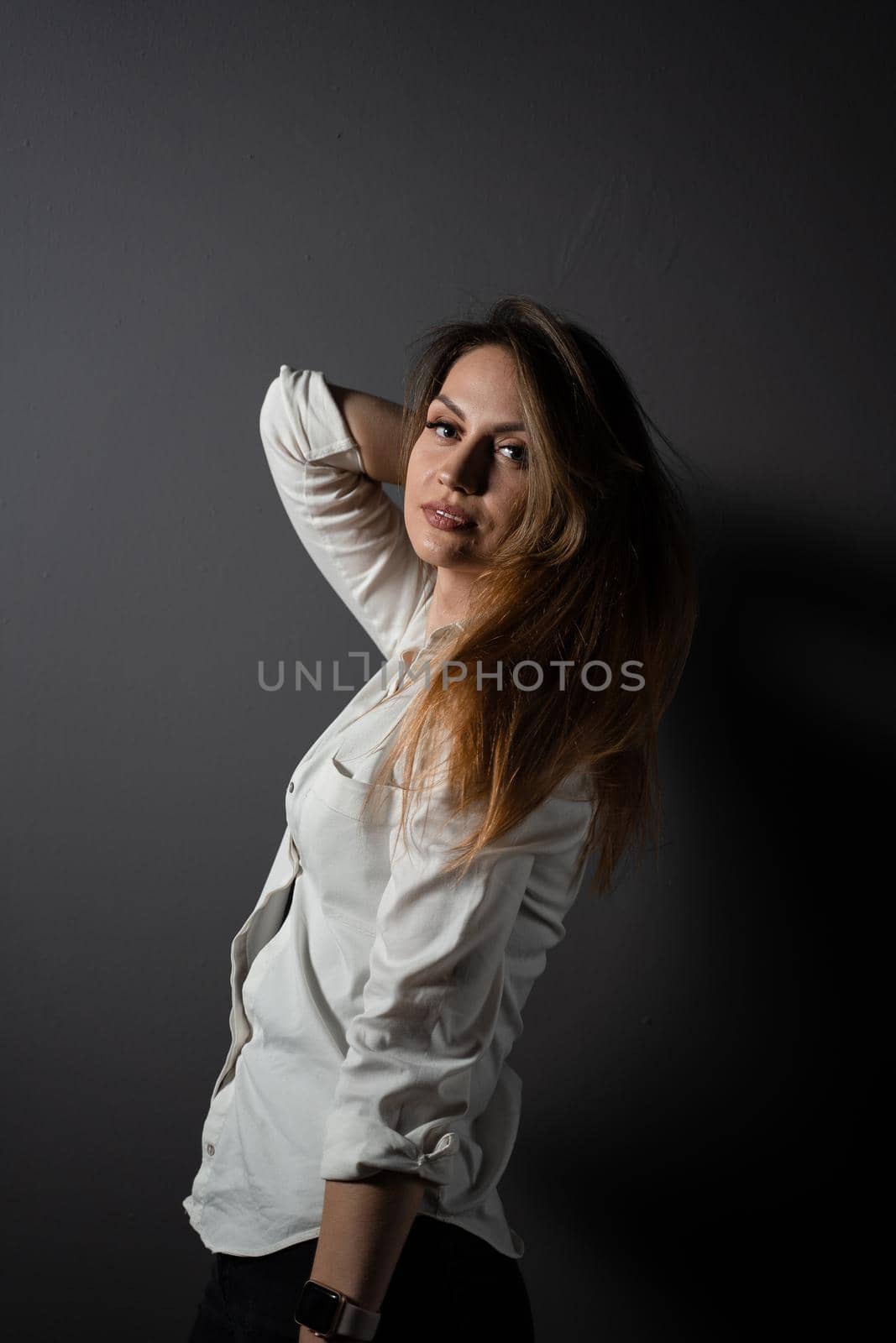 Business woman portrait on black background. Confident model posing. Lifestyle