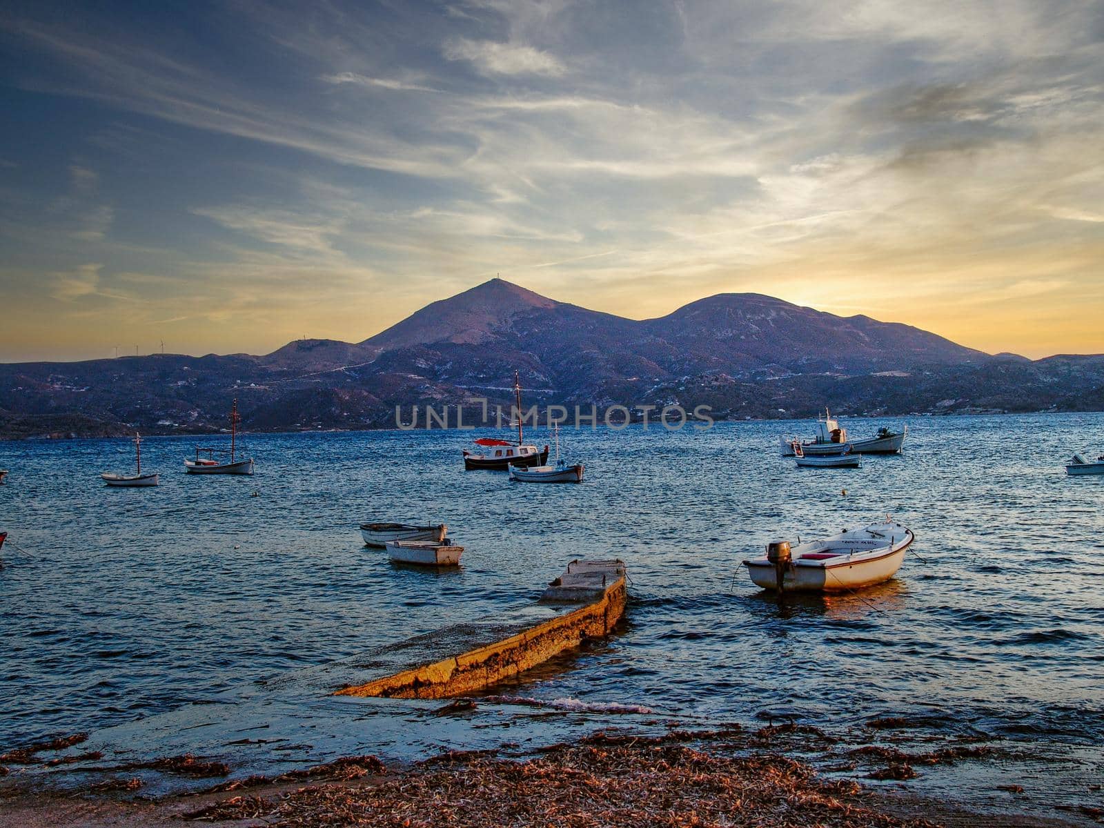 Scenic picturesque sunset in greek fishing village Klima with traditional houses , Milos island