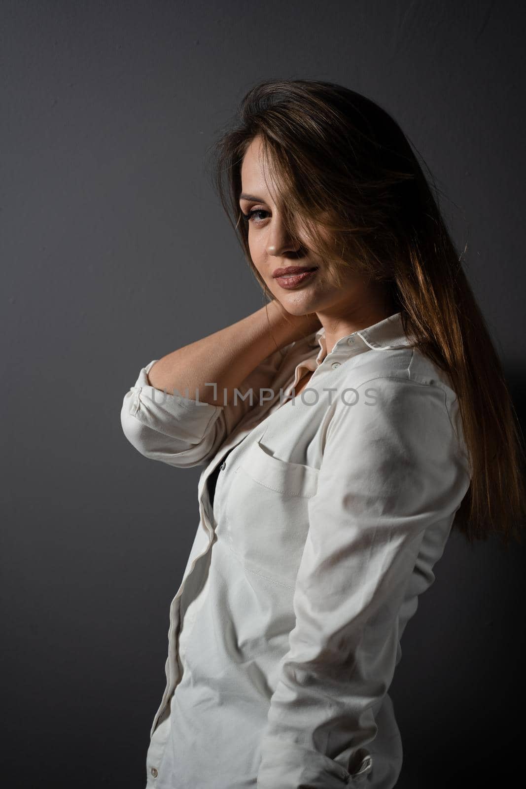 Business woman portrait on black background. Confident model posing. Lifestyle