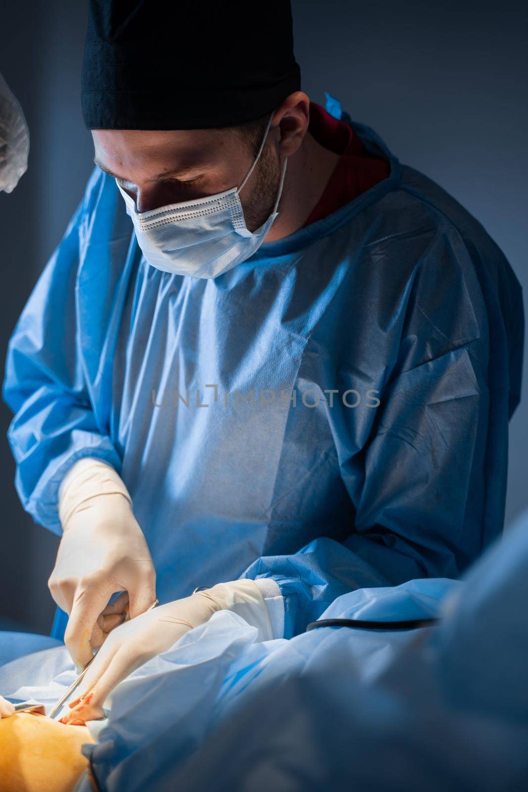 Vascular surgeon removing veins from the leg