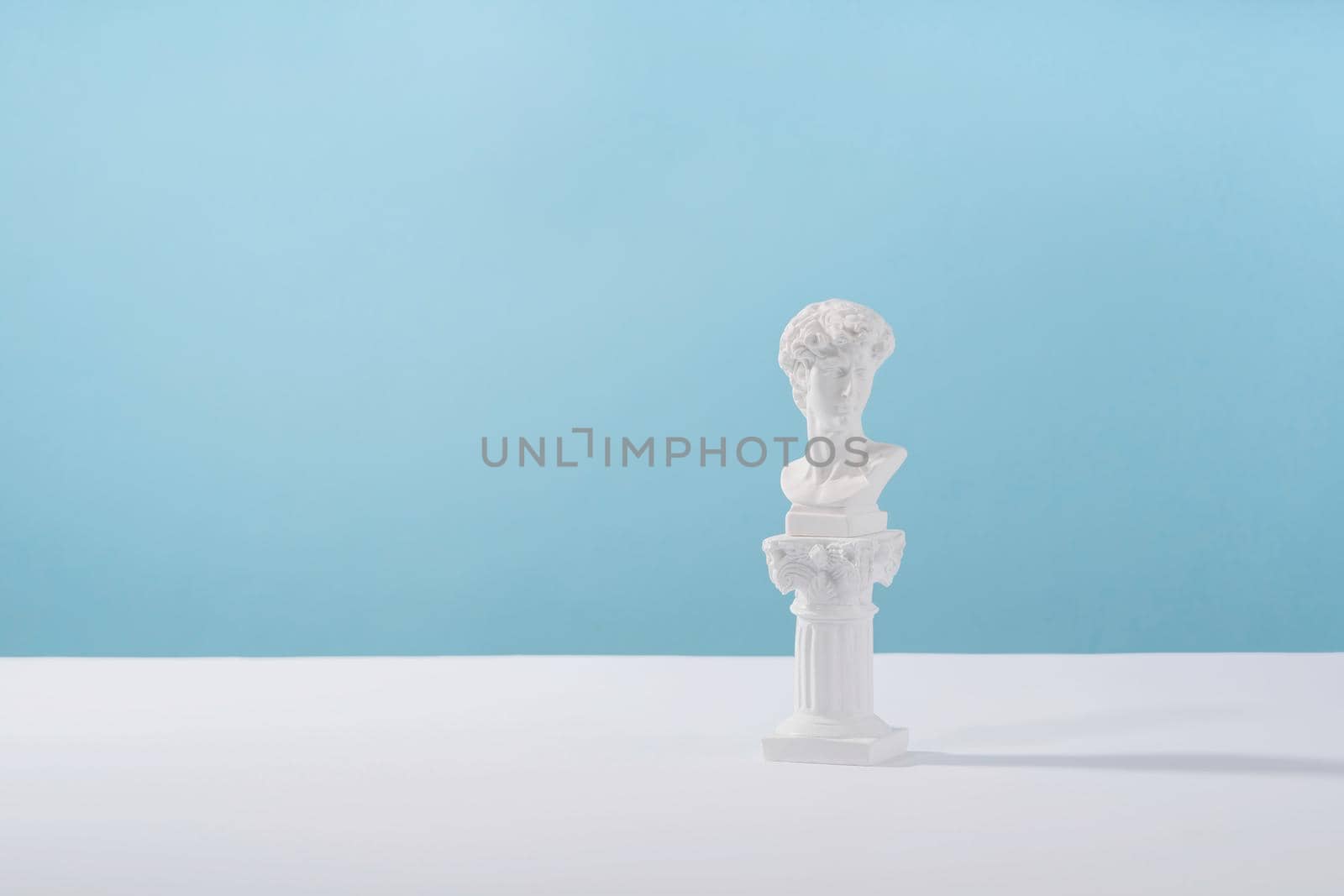 Cosmetic display podium platform greek man with roman marble column for product presentation, cosmetics geometric stand stylish props, mockup scene aesthetic on blue. Creative product stage.. by photolime